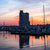 A colorful sky develops as the sun sets over the Baltimore harbor.