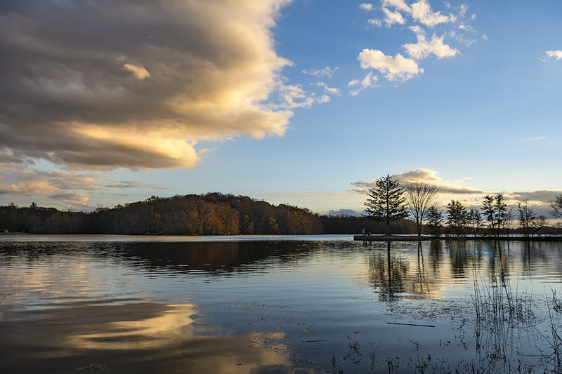 A large cloud reflects above Pinchot Lake in Pennsylvania.