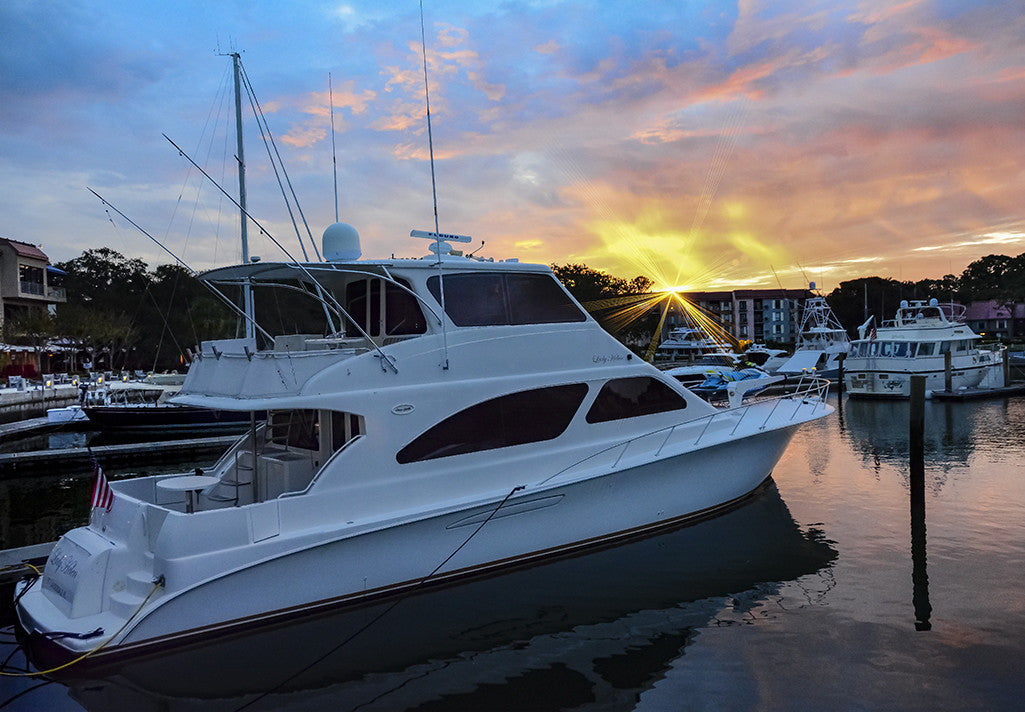 The rising sun breaks over the roof line in Hilton Head Island's Shelter Cove. 