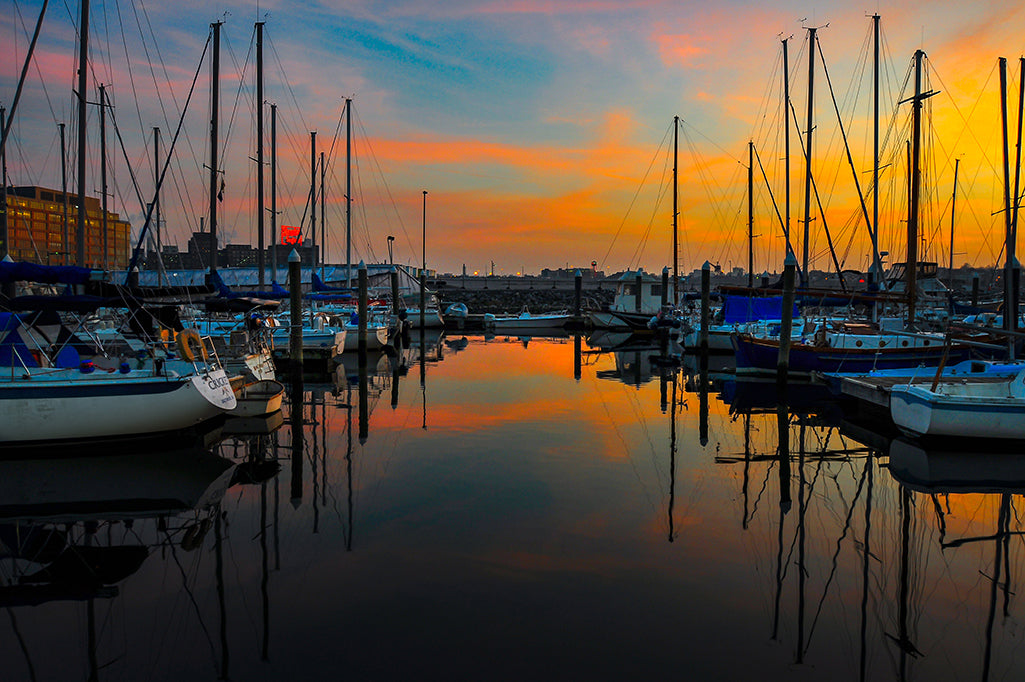A magnificent sunset is captured at the Harbor East Marina in Baltimore, Maryland.