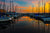 A magnificent sunset is captured at the Harbor East Marina in Baltimore, Maryland.