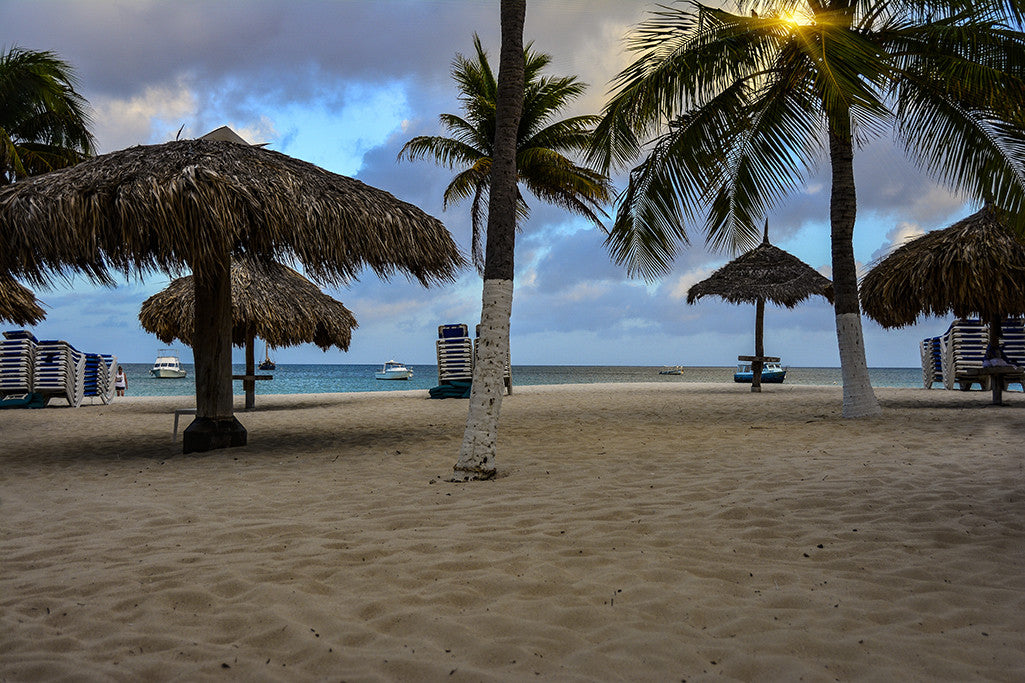 The sun shines though a cloudy sky on Paradise Island, Bahamas.