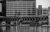 A footbridge connects two sections of the National Aquarium in Baltimore, spanning piers 3 and 4.
