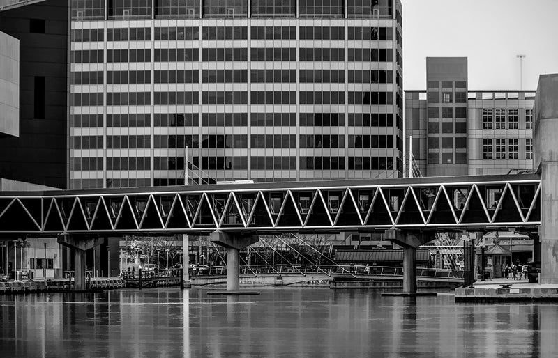 A footbridge connects two sections of the National Aquarium in Baltimore, spanning piers 3 and 4.