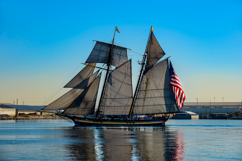The Pride of Baltimore II sails up the Patapsco River in Baltimore.