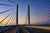 A beautiful sunrise sky adds beauty to this photograph of the Indian River Inlet Bridge in Dewey Beach, Delaware.