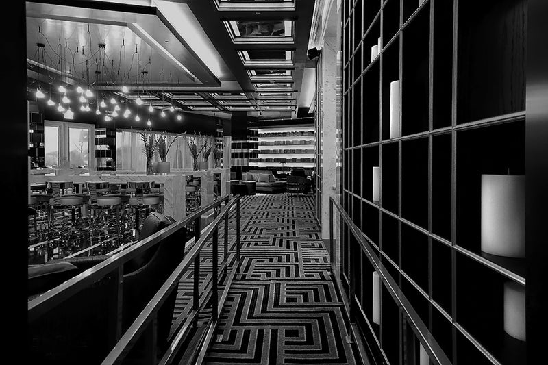 Patterns and lines converge in this black and white fine art photograph of a fine dining establishment.